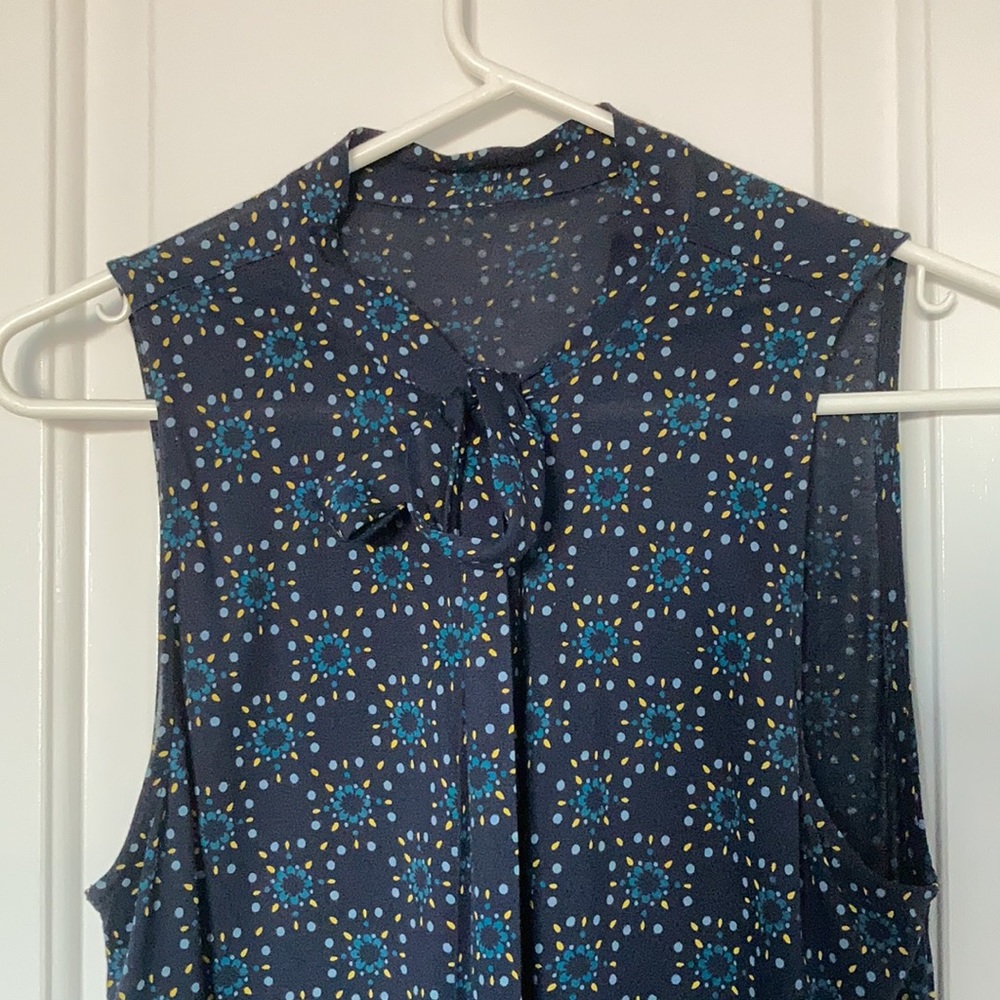 Blue and yellow diamond patterned blouse with front bow